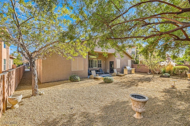 back of house with a patio