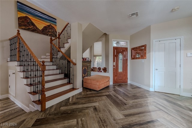 foyer featuring parquet floors