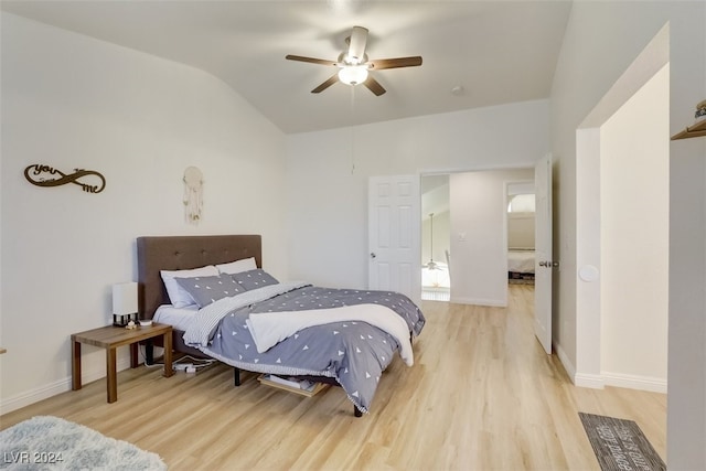 bedroom featuring ceiling fan, light hardwood / wood-style flooring, and lofted ceiling