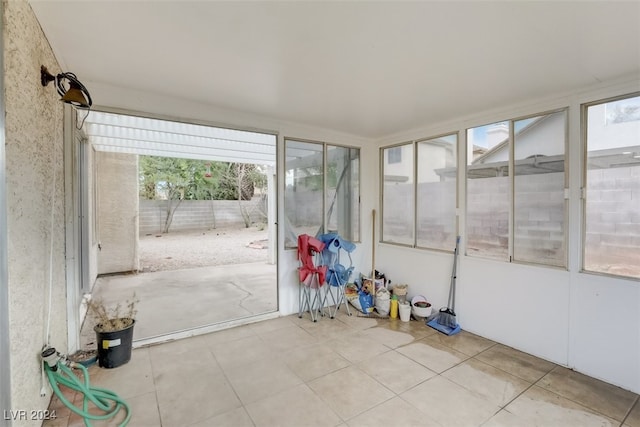 unfurnished sunroom featuring a healthy amount of sunlight