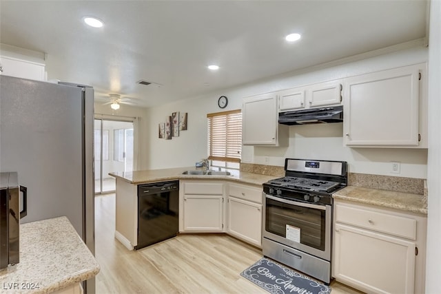 kitchen featuring white cabinetry, sink, light wood-type flooring, and appliances with stainless steel finishes