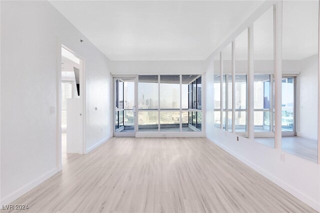 4575 Dean Martin Dr Unit 2211, Las Vegas, NV 89103 - empty room featuring wood finished floors and baseboards