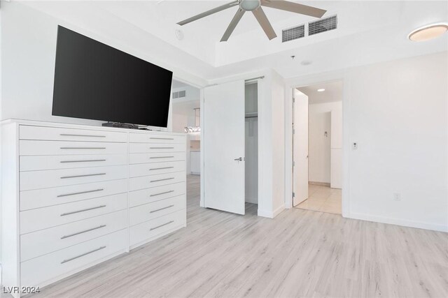 4575 Dean Martin Dr Unit 2211, Las Vegas, NV 89103 - unfurnished bedroom featuring light wood-style floors, baseboards, a tray ceiling, and recessed lighting