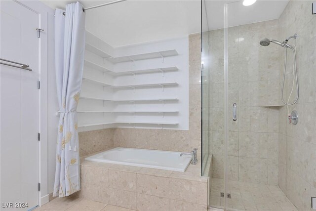 4575 Dean Martin Dr Unit 2211, Las Vegas, NV 89103 - bathroom with a shower stall, a bath, and tile patterned flooring