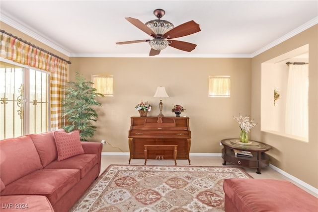 living room featuring ceiling fan, a healthy amount of sunlight, and ornamental molding