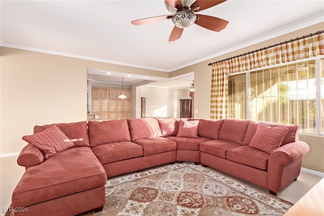 living room with ceiling fan and crown molding