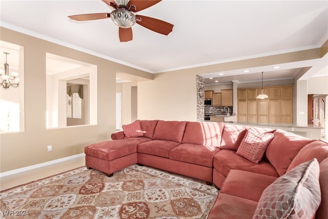 living room featuring ceiling fan with notable chandelier and crown molding