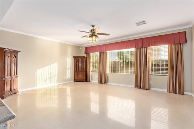 interior space featuring ceiling fan, light tile patterned floors, and ornamental molding