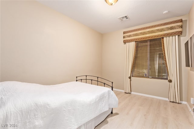 bedroom with light hardwood / wood-style flooring