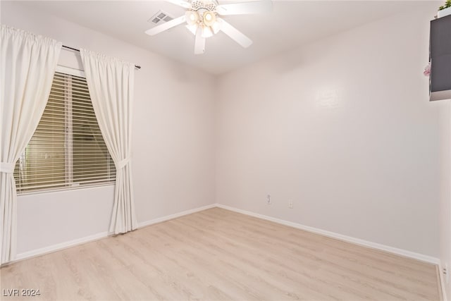 unfurnished room featuring ceiling fan and light hardwood / wood-style flooring