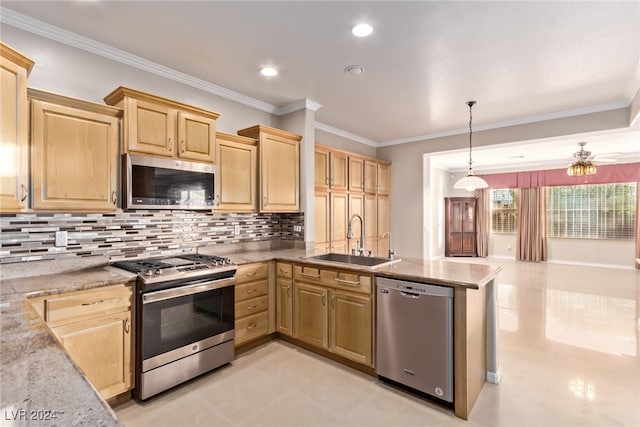 kitchen featuring sink, hanging light fixtures, stainless steel appliances, backsplash, and crown molding