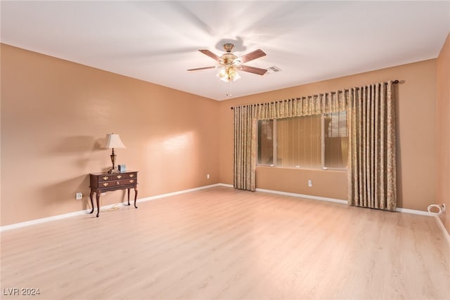 spare room featuring ceiling fan and light hardwood / wood-style floors