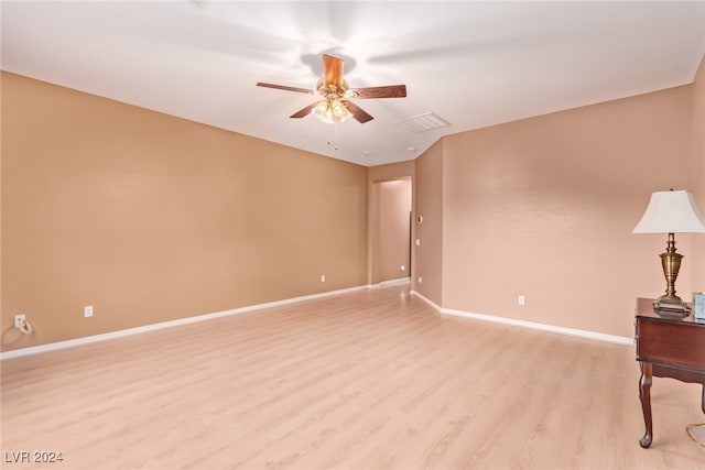 empty room featuring light wood-type flooring and ceiling fan