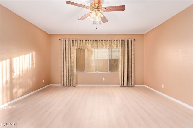 unfurnished room with ceiling fan and light hardwood / wood-style flooring