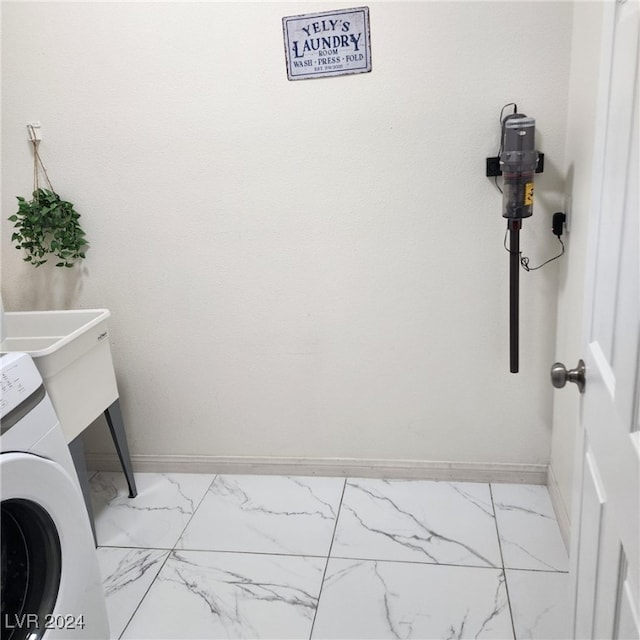 laundry room featuring washer / dryer