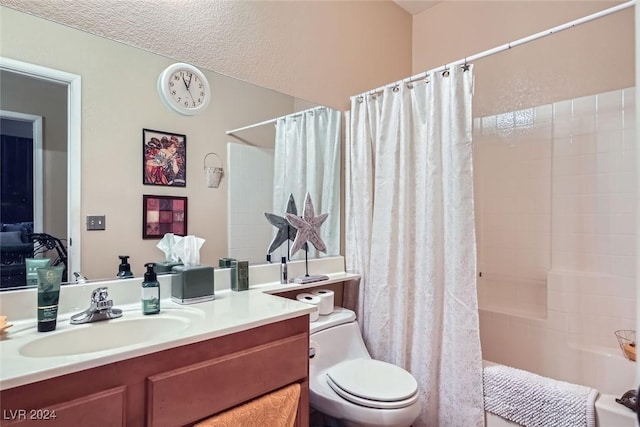 full bathroom featuring toilet, vanity, a textured ceiling, and shower / tub combo with curtain