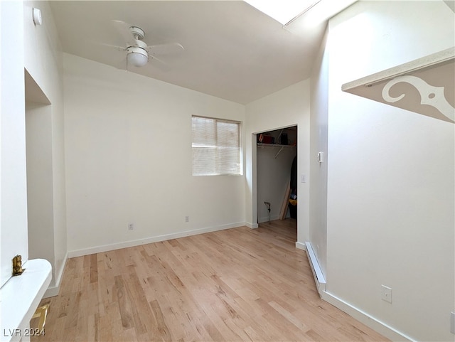 unfurnished bedroom featuring light hardwood / wood-style floors, a closet, and ceiling fan