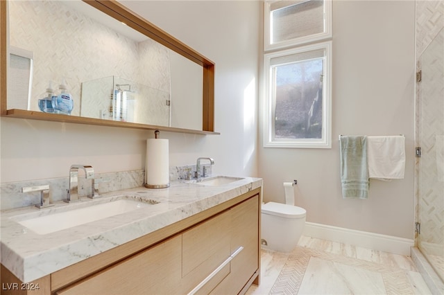 bathroom with vanity, an enclosed shower, and toilet