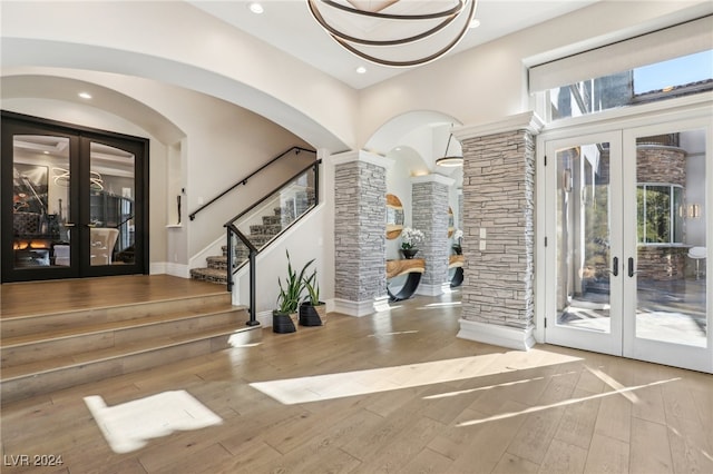 interior space with french doors and light hardwood / wood-style flooring