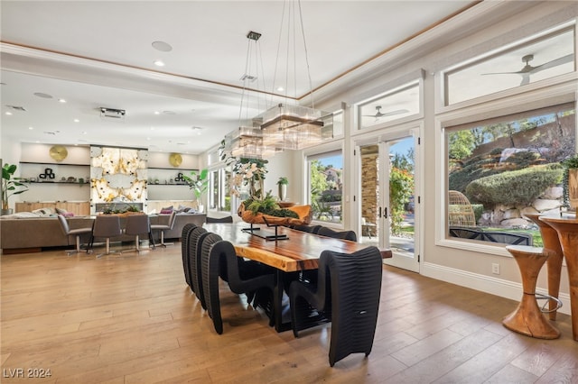 dining area with ceiling fan, hardwood / wood-style floors, and french doors