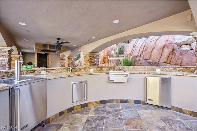 view of patio / terrace featuring ceiling fan