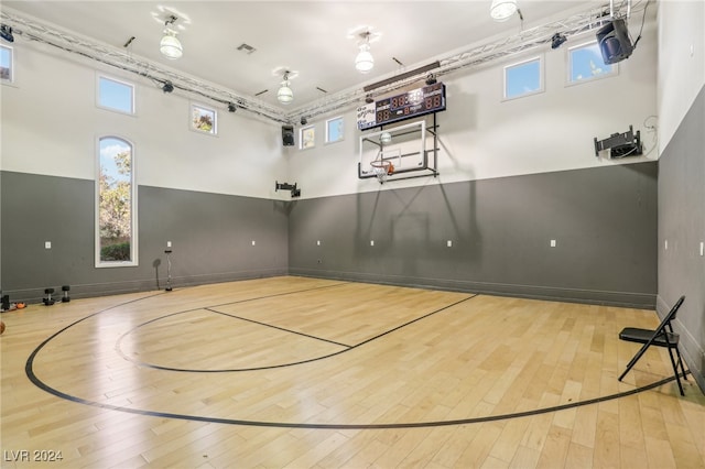 view of sport court featuring a healthy amount of sunlight