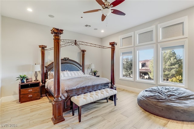 bedroom with ceiling fan and light hardwood / wood-style flooring