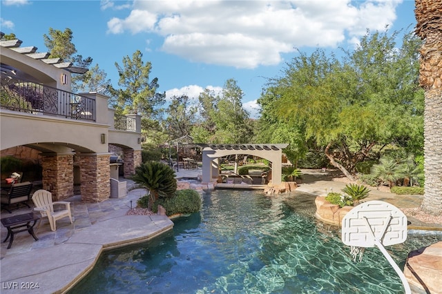 view of swimming pool featuring a patio and a pergola