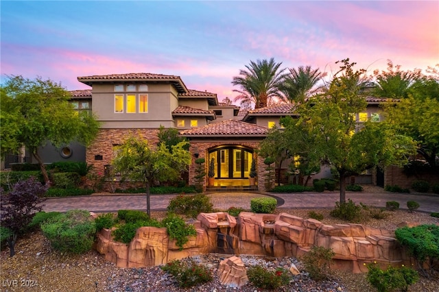 view of front of property featuring french doors and a patio