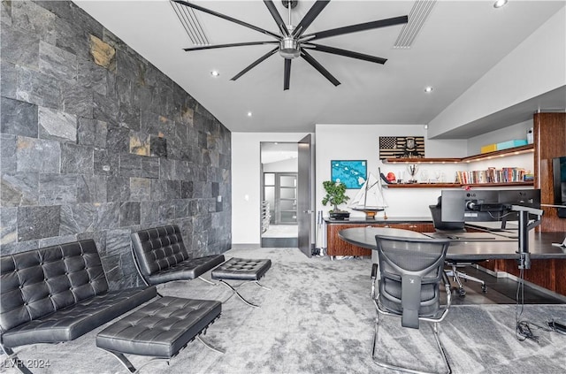 interior space featuring ceiling fan and vaulted ceiling