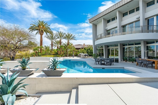 view of pool featuring a patio area