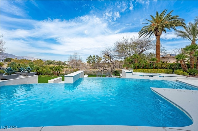 view of pool with a mountain view