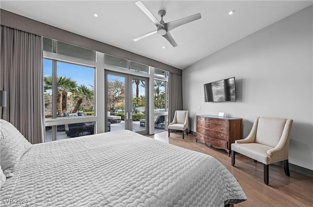 bedroom featuring hardwood / wood-style flooring, ceiling fan, access to outside, and multiple windows