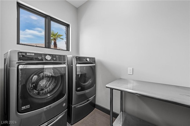 washroom with washing machine and clothes dryer