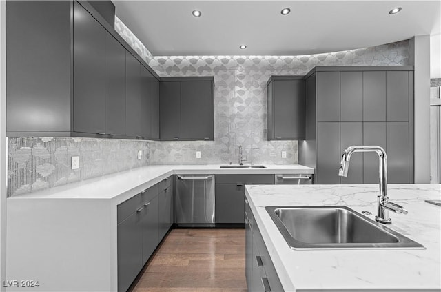 kitchen with gray cabinets, dishwasher, dark hardwood / wood-style floors, and sink