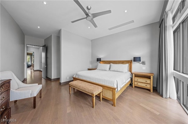 bedroom featuring hardwood / wood-style flooring and ceiling fan