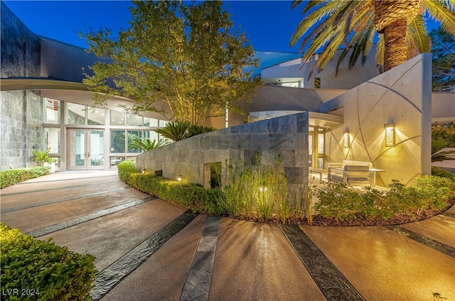 view of property exterior with french doors