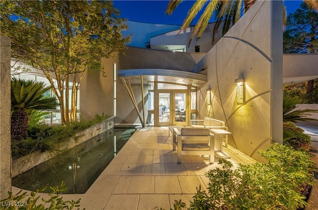 exterior space with a swimming pool and french doors