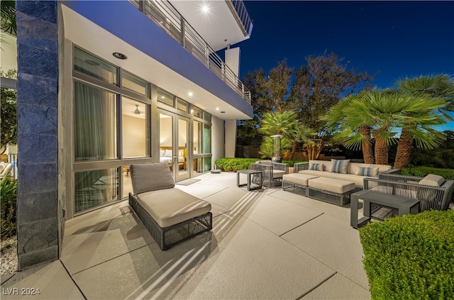 patio at twilight with an outdoor hangout area