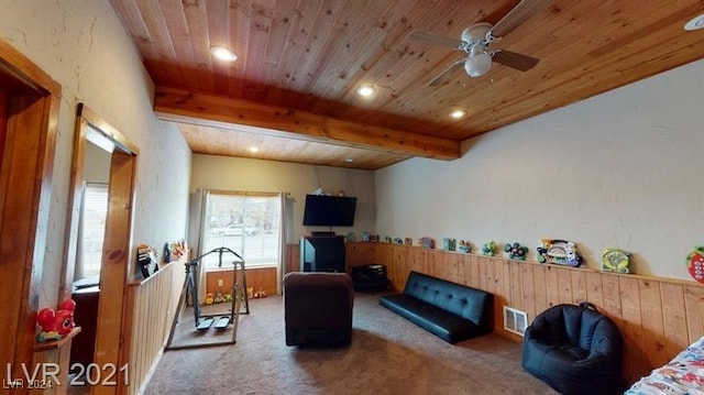 interior space with beamed ceiling, ceiling fan, wood ceiling, and carpet flooring