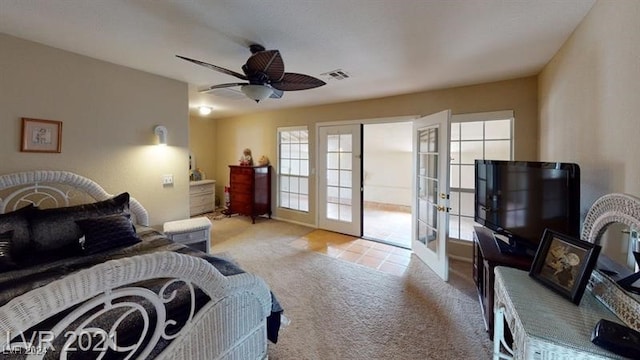 carpeted bedroom with ceiling fan and french doors