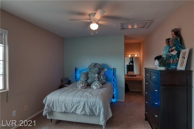 bedroom featuring ceiling fan and carpet