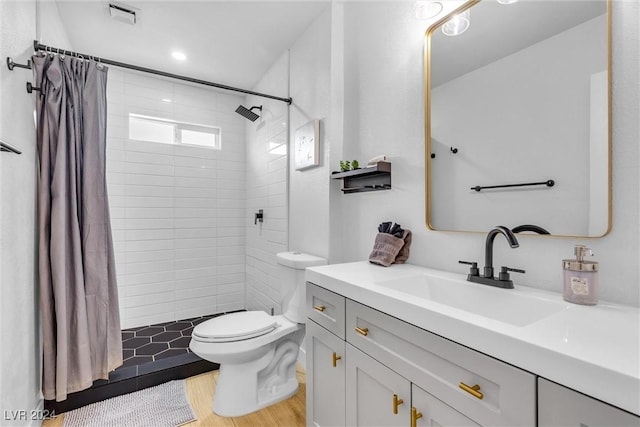 bathroom featuring vanity, curtained shower, toilet, and wood-type flooring