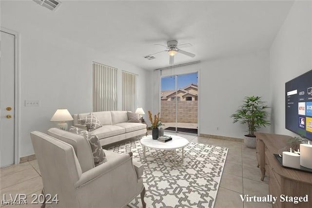 tiled living room featuring ceiling fan