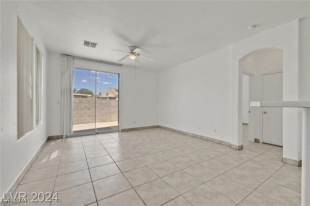 spare room featuring ceiling fan and light tile patterned flooring