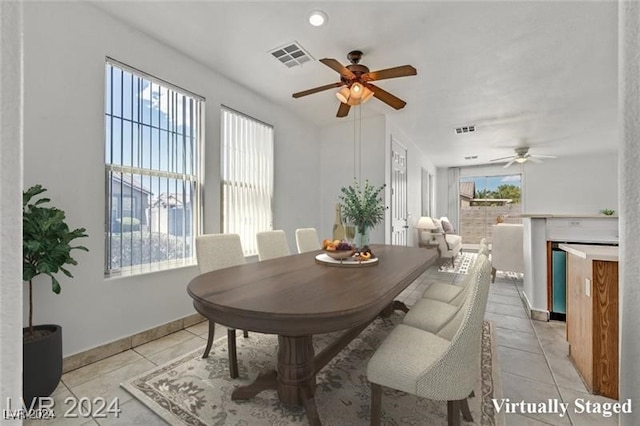 dining area with ceiling fan and light tile patterned floors