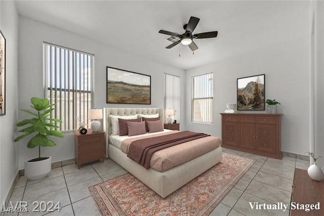 bedroom with ceiling fan and light tile patterned floors