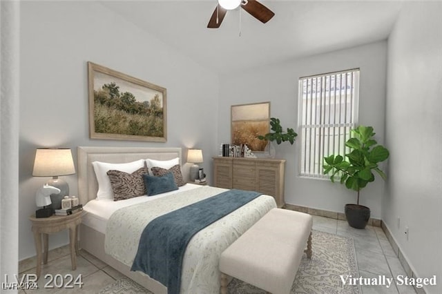 bedroom featuring ceiling fan and light tile patterned floors