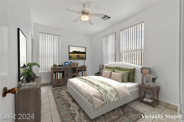 tiled bedroom with ceiling fan