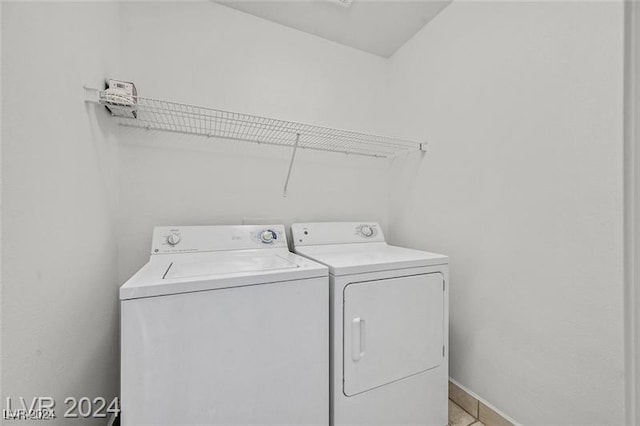 clothes washing area featuring washer and dryer